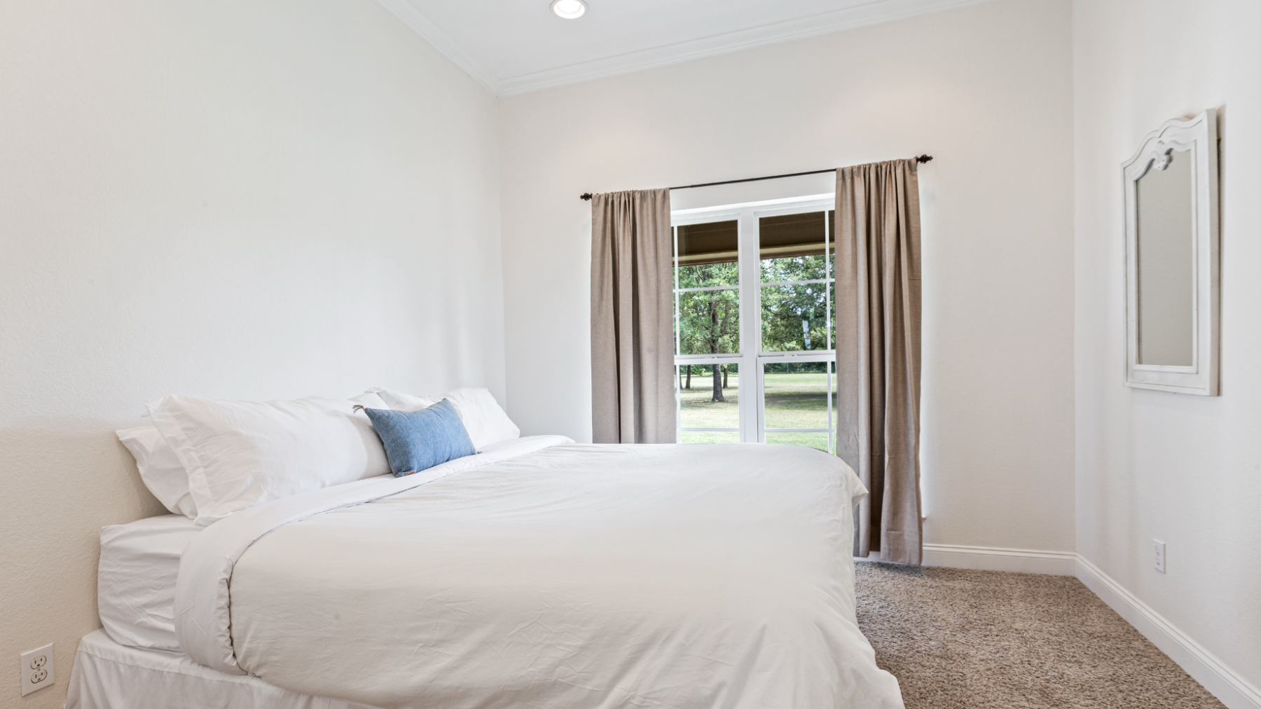 a bedroom with a bed in a room